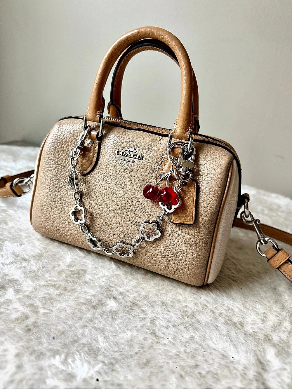 Coach Mini Rowan Crossbody bag in beige with charm